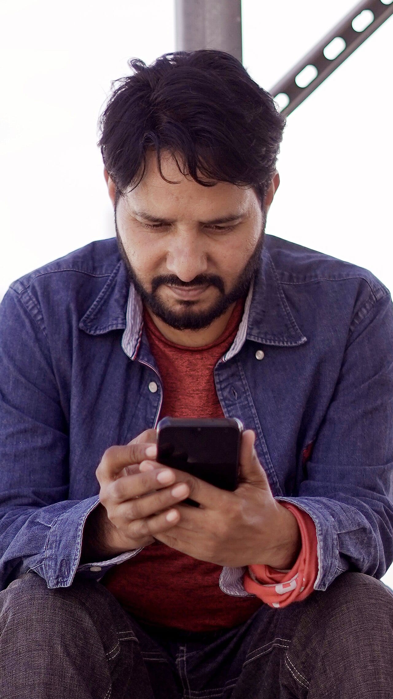 A man looking at his smartphone
