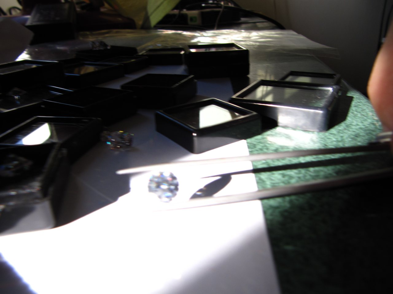 A diamond being examined with tweezers (file photo)