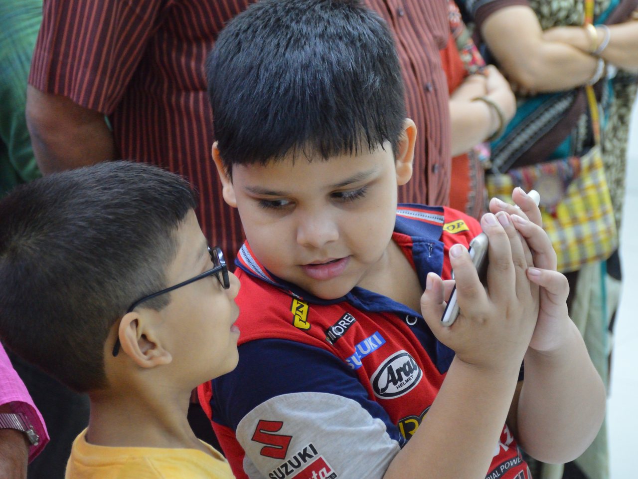 Children looking at a smartphone